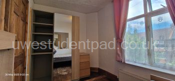 Fitted wardrobes in single room