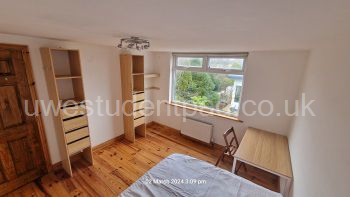 Wardrobes and cloths hanging in double room